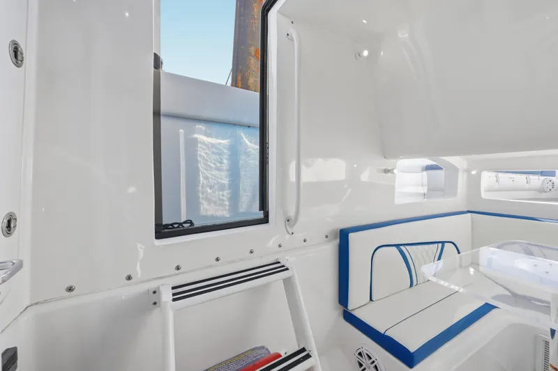  Yacht Photos Pics Interior of 2019 Midnight Express 43 Open boat with white and blue seating.