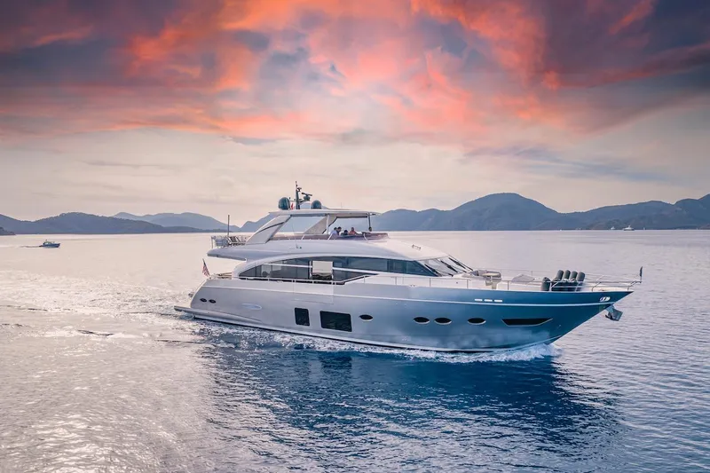 Lady Parisa Yacht Photos Pics 2014 Princess 88 Motor Yacht cruising at sunset with scenic mountain backdrop.