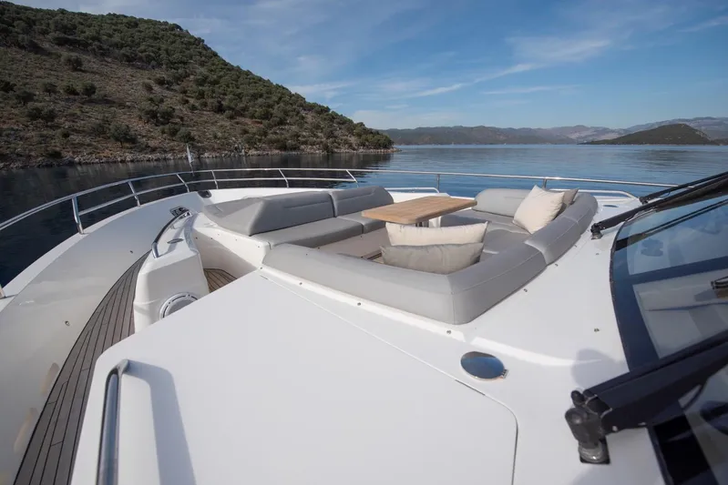 Lady Parisa Yacht Photos Pics Luxurious 2014 Princess 88 Motor Yacht with elegant deck seating and scenic ocean view.