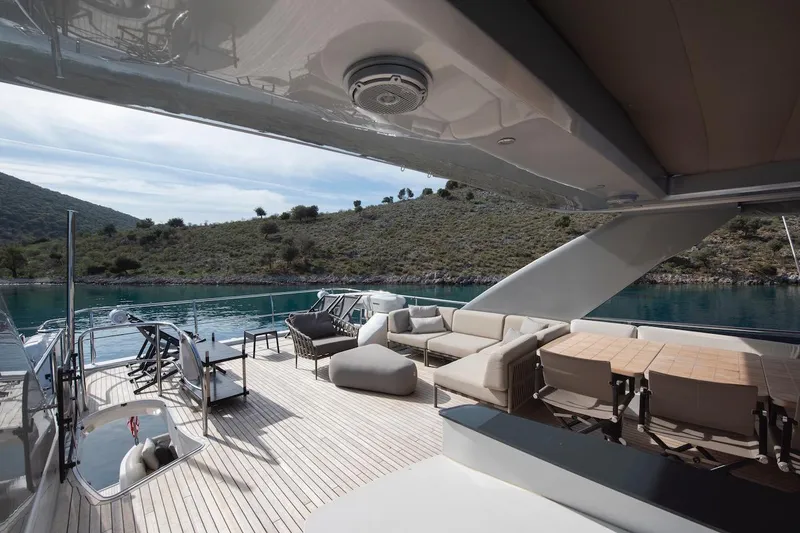 Lady Parisa Yacht Photos Pics Luxurious deck of 2014 Princess 88 Motor Yacht with elegant seating and scenic water view.