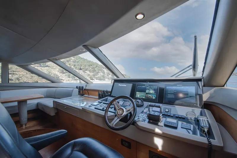 Lady Parisa Yacht Photos Pics Luxurious helm of 2014 Princess 88 Motor Yacht with panoramic windows and advanced navigation systems.