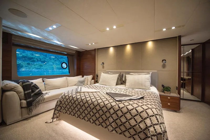 Lady Parisa Yacht Photos Pics Luxurious bedroom interior of 2014 Princess 88 Motor Yacht with elegant decor and large window view.