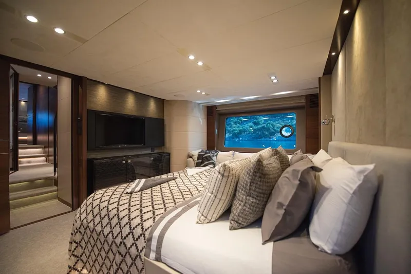 Lady Parisa Yacht Photos Pics Luxurious bedroom interior of 2014 Princess 88 Motor Yacht with scenic window view.