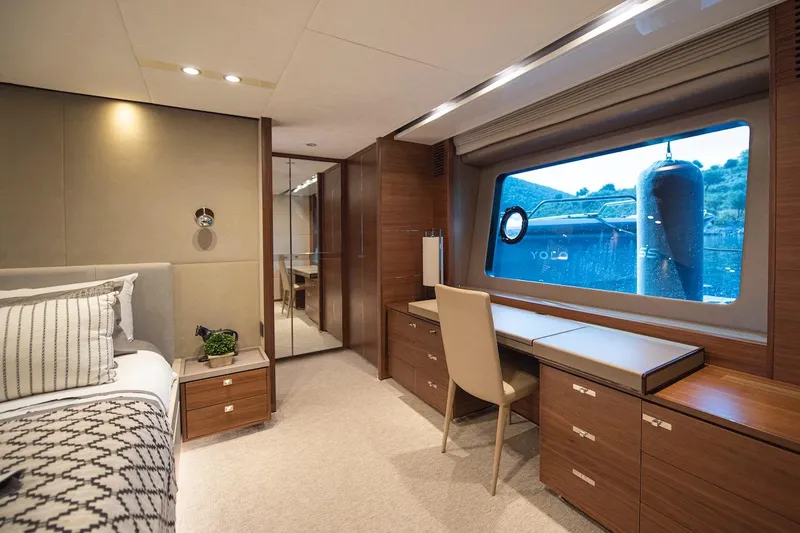 Lady Parisa Yacht Photos Pics Luxurious interior of 2014 Princess 88 Motor Yacht with elegant wood finishes and large window.