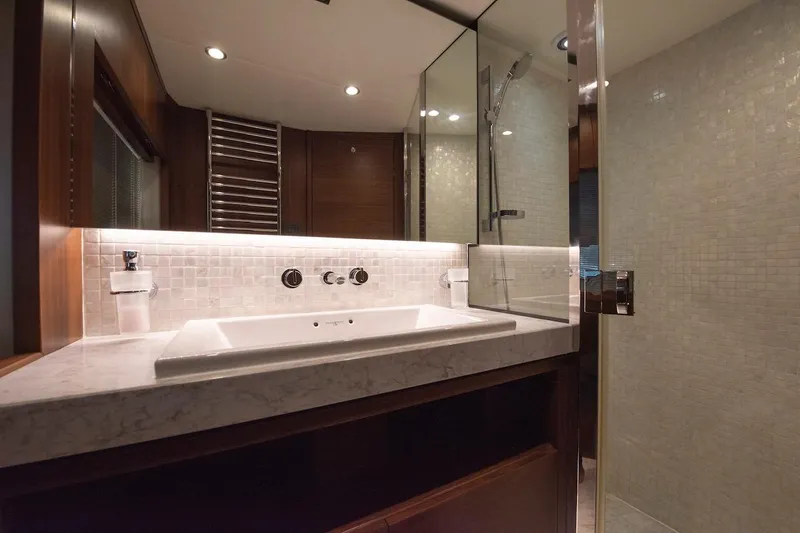 Lady Parisa Yacht Photos Pics Luxurious bathroom in 2014 Princess 88 Motor Yacht with modern fixtures and elegant design.
