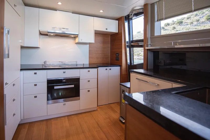 Lady Parisa Yacht Photos Pics Luxurious kitchen interior of 2014 Princess 88 Motor Yacht with modern appliances.