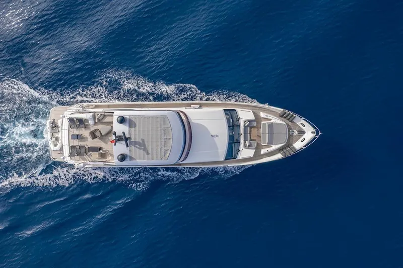 Lady Parisa Yacht Photos Pics Overhead view of 2014 Princess 88 Motor Yacht cruising on blue ocean waters.