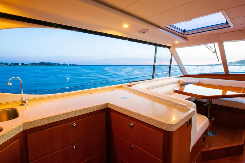  Yacht Photos Pics Luxurious interior of 2018 Hylas M44 yacht with ocean view through large windows.