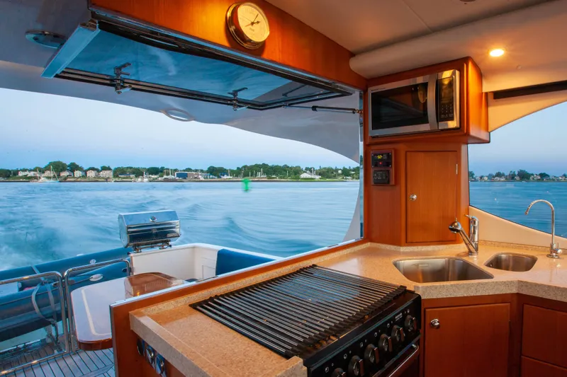  Yacht Photos Pics Interior view of 2018 Hylas M44 yacht kitchen with ocean backdrop.