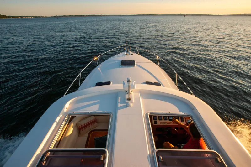  Yacht Photos Pics 2018 Hylas M44 yacht cruising on open water at sunset.