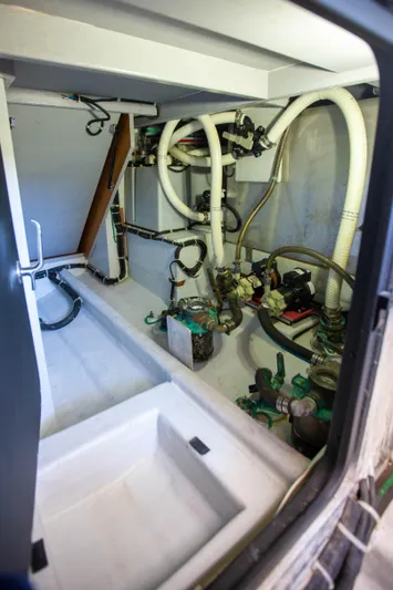  Yacht Photos Pics Engine room of 2018 Hylas M44 yacht with visible pipes and machinery.