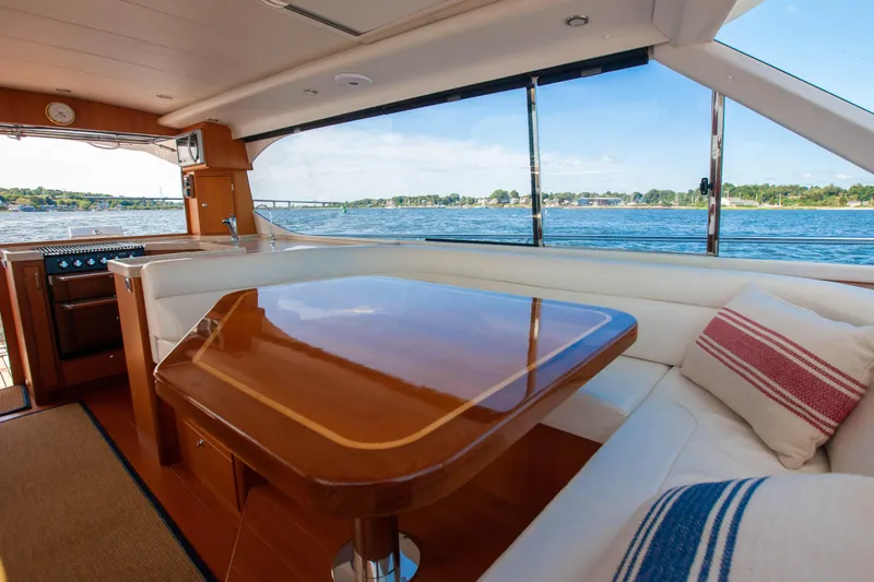  Yacht Photos Pics Interior of 2018 Hylas M44 yacht with elegant dining area and scenic water view.