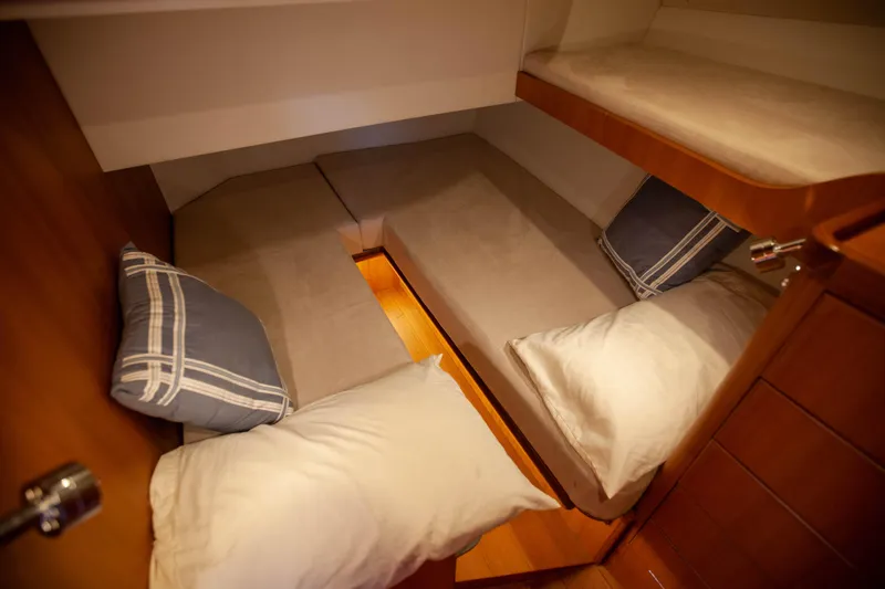  Yacht Photos Pics Cozy cabin interior of 2018 Hylas M44 yacht with comfortable bedding.