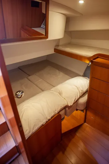  Yacht Photos Pics 2018 Hylas M44 yacht interior cabin with wooden finish and cozy bedding.