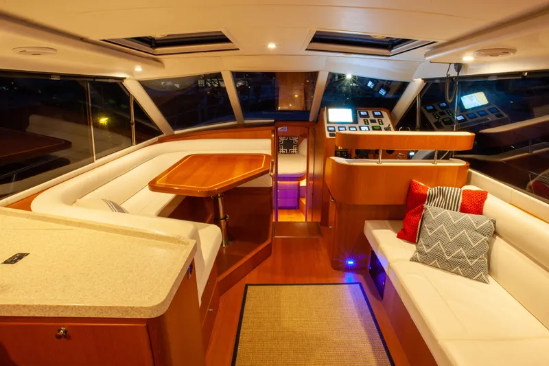  Yacht Photos Pics Luxurious interior of 2018 Hylas M44 yacht with elegant seating and modern navigation controls.