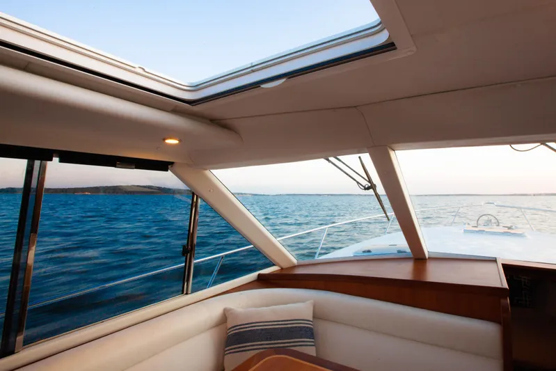  Yacht Photos Pics Interior view of 2018 Hylas M44 yacht with ocean and sky visible through windows.