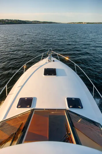  Yacht Photos Pics 2018 Hylas M44 yacht cruising on open water at sunset.