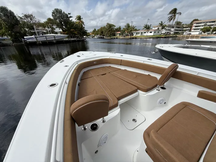  Yacht Photos Pics 2023 Sea Hunt Gamefish 30 with forward seating, docked in a scenic marina.
