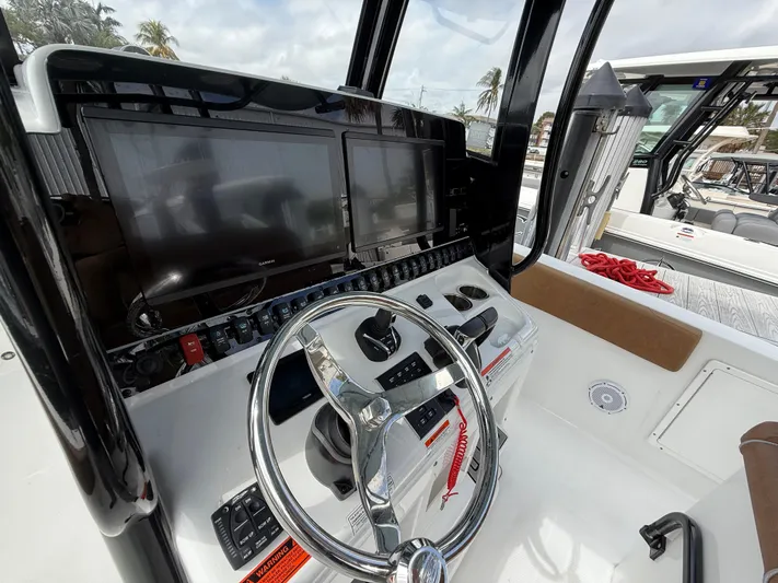  Yacht Photos Pics 2023 Sea Hunt Gamefish 30 helm with dual screens and steering wheel.
