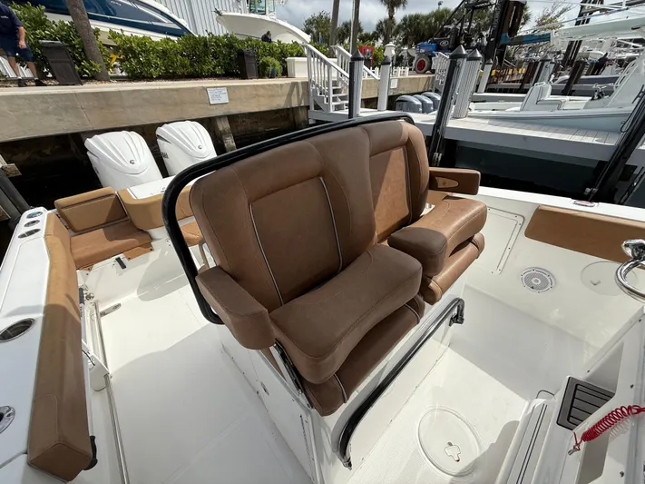  Yacht Photos Pics 2023 Sea Hunt Gamefish 30 boat with brown forward seating and sleek design.