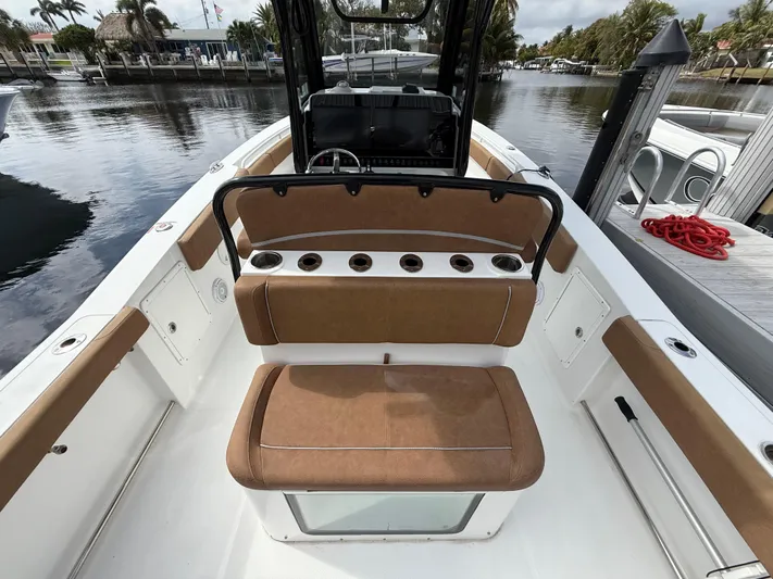  Yacht Photos Pics 2023 Sea Hunt Gamefish 30 Forward Seating boat interior with tan cushions and rod holders.