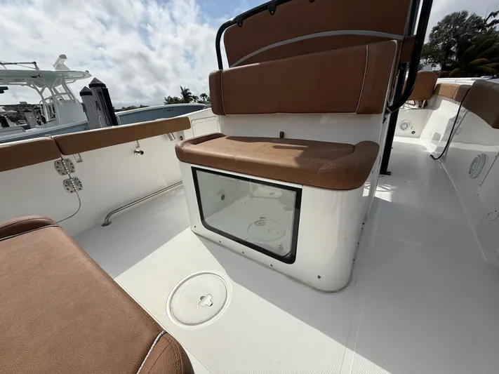  Yacht Photos Pics 2023 Sea Hunt Gamefish 30 Forward Seating with brown cushions and storage compartment.