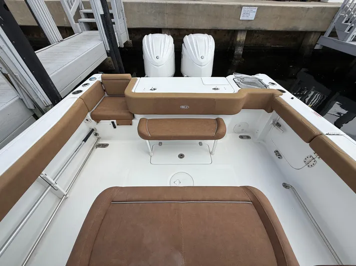  Yacht Photos Pics 2023 Sea Hunt Gamefish 30 boat with forward seating and twin engines at dock.