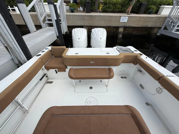  Yacht Photos Pics 2023 Sea Hunt Gamefish 30 boat with forward seating and twin engines at dock.