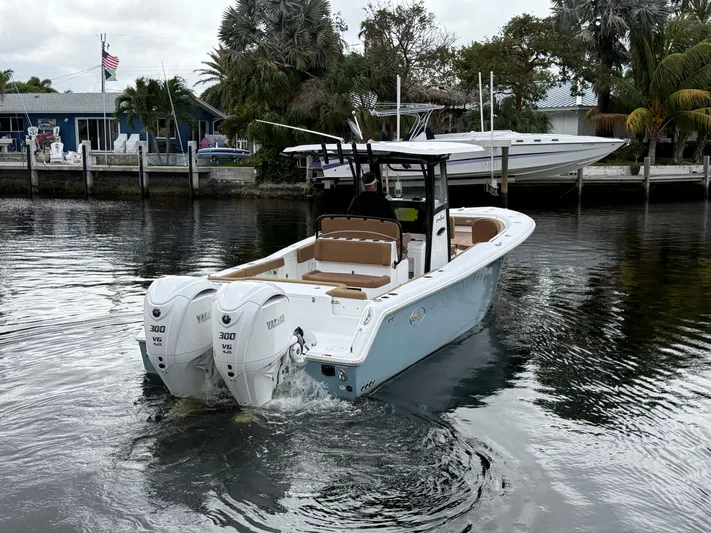  Yacht Photos Pics 2023 Sea Hunt Gamefish 30 boat with dual engines on a calm waterway.