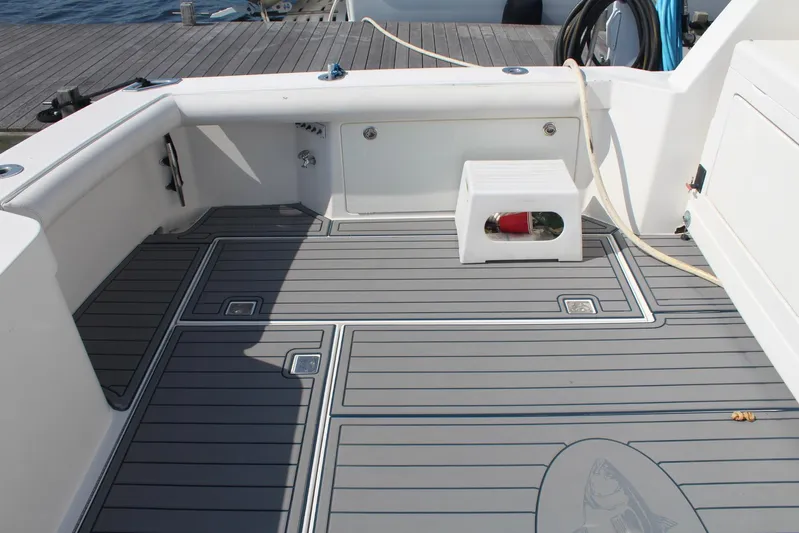 Pescador Yacht Photos Pics 2013 Cabo 40 Hardtop Express boat deck with gray flooring and white seating.