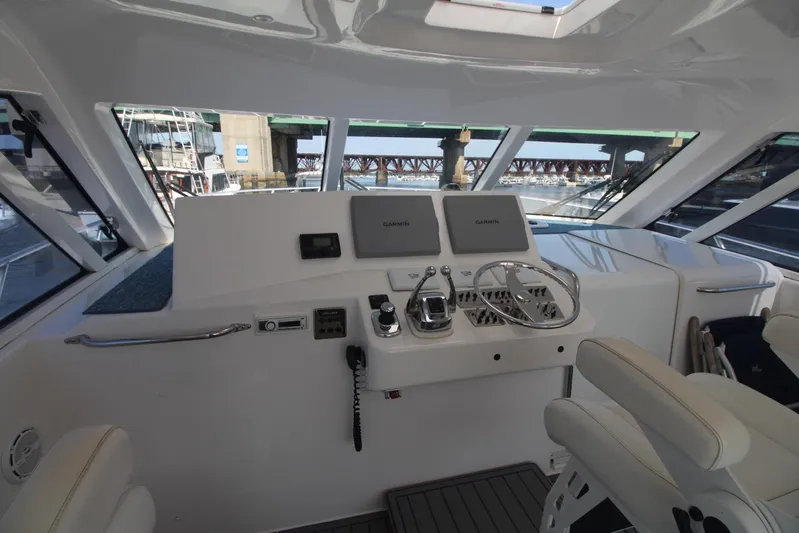 Pescador Yacht Photos Pics Helm of 2013 Cabo 40 Hardtop Express yacht with modern controls and navigation equipment.