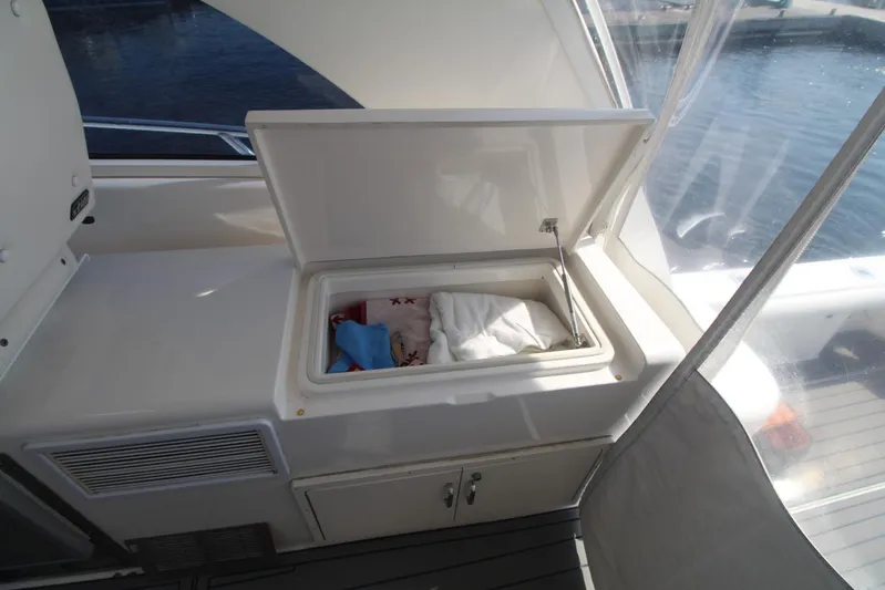 Pescador Yacht Photos Pics Open storage compartment on 2013 Cabo 40 Hardtop Express boat deck.