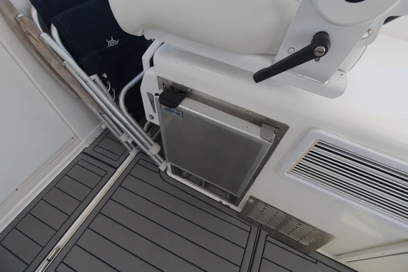 Pescador Yacht Photos Pics Cabo 40 Hardtop Express 2013 boat interior with seating and storage compartment.