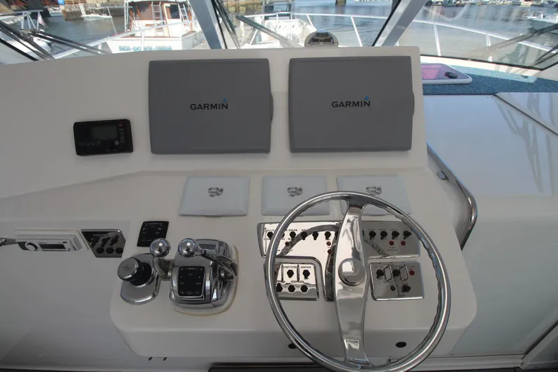 Pescador Yacht Photos Pics Helm of 2013 Cabo 40 Hardtop Express with Garmin navigation displays and controls.