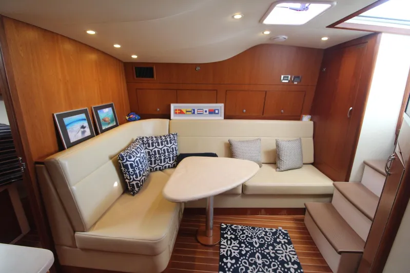 Pescador Yacht Photos Pics Luxurious interior of 2013 Cabo 40 Hardtop Express yacht with elegant seating and decor.