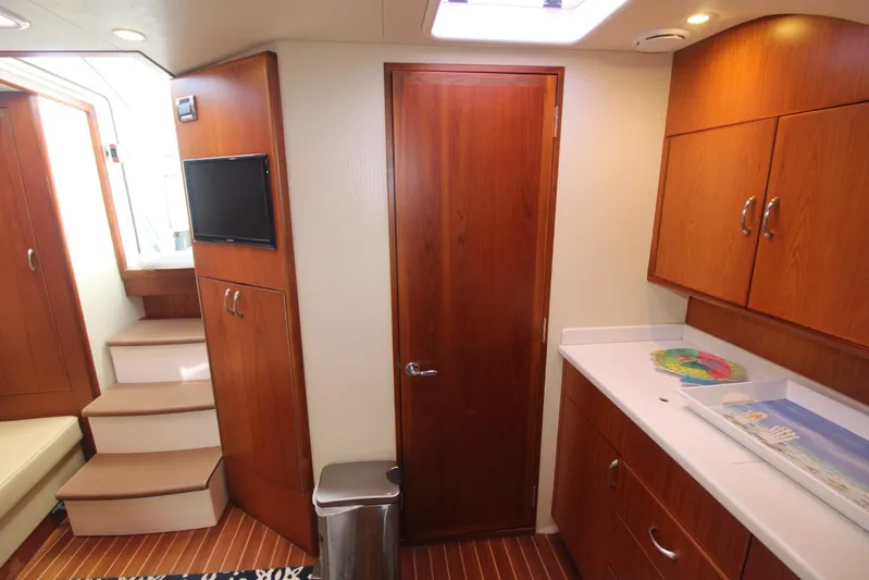 Pescador Yacht Photos Pics Interior of 2013 Cabo 40 Hardtop Express yacht with wood cabinetry and modern amenities.