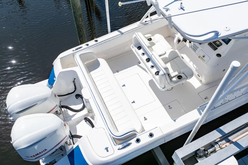  Yacht Photos Pics 2015 Intrepid 327 Cuddy boat with Yamaha engines, featuring spacious seating and modern controls.