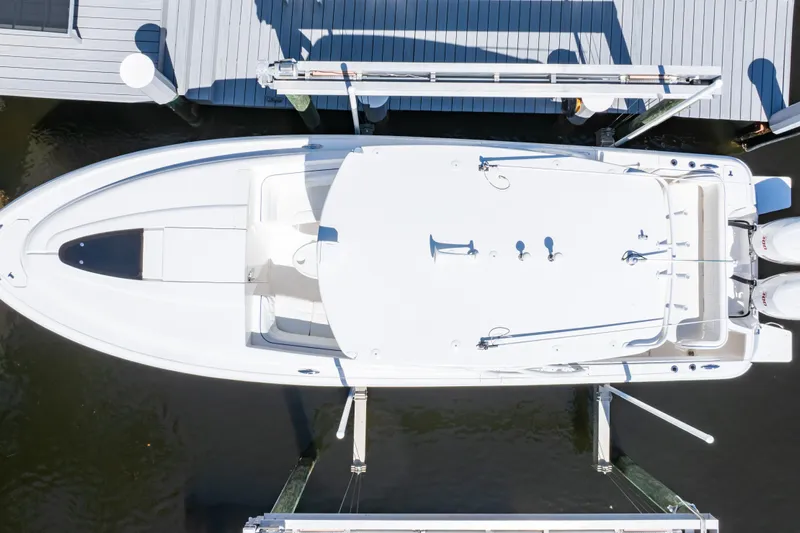  Yacht Photos Pics Overhead view of a 2015 Intrepid 327 Cuddy boat docked at a marina.