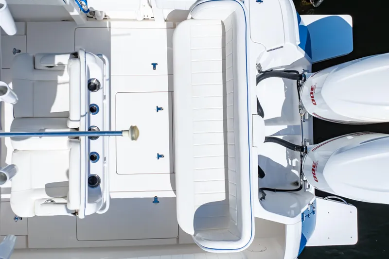  Yacht Photos Pics 2015 Intrepid 327 Cuddy boat interior with seating and dual outboard engines.