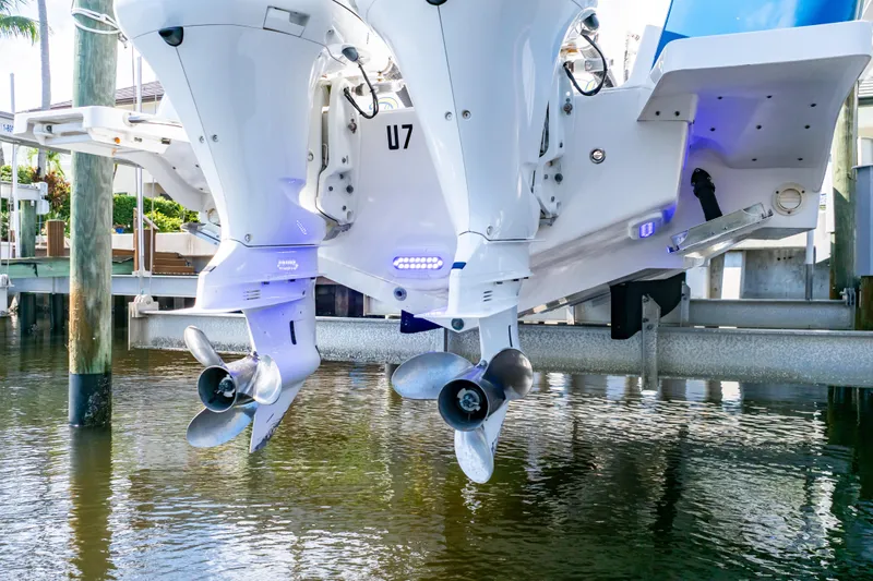  Yacht Photos Pics 2015 Intrepid 327 Cuddy boat engines above water at dock.