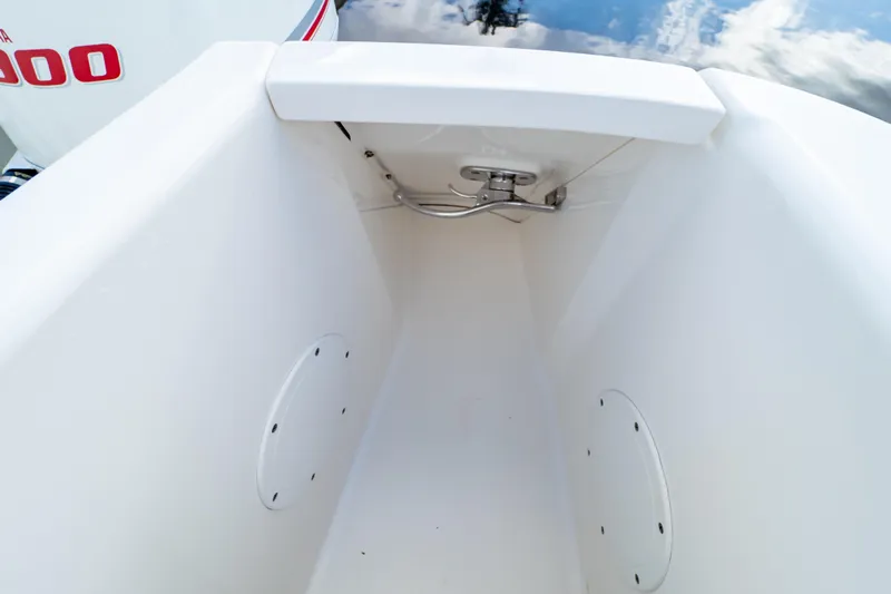  Yacht Photos Pics 2015 Intrepid 327 Cuddy boat storage compartment with stainless steel hardware.
