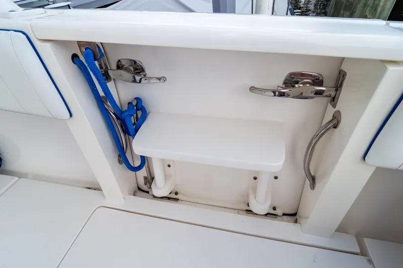  Yacht Photos Pics 2015 Intrepid 327 Cuddy boat interior with blue rope and stainless steel fittings.