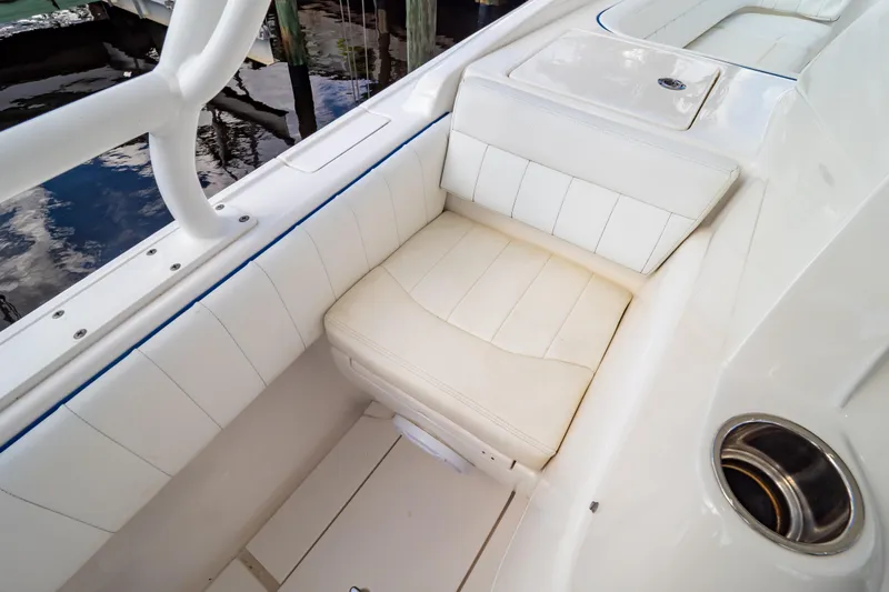  Yacht Photos Pics 2015 Intrepid 327 Cuddy boat interior with white cushioned seating.