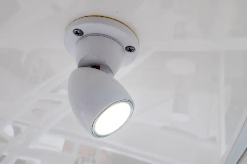  Yacht Photos Pics Close-up of a ceiling light fixture on a 2015 Intrepid 327 Cuddy boat.