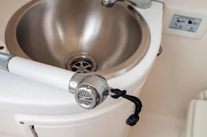  Yacht Photos Pics Stainless steel sink with a handheld showerhead on a 2015 Intrepid 327 Cuddy boat.
