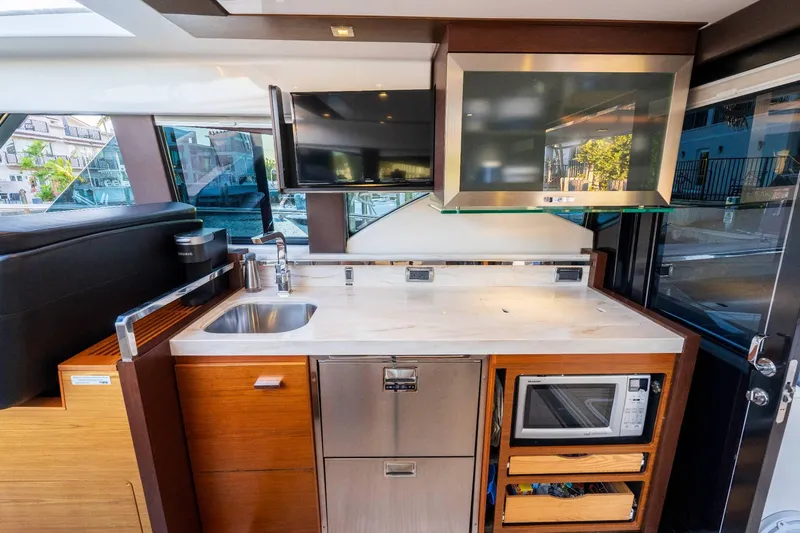 Down Time Yacht Photos Pics Interior of 2015 Tiara Yachts C44 Coupe with modern kitchen amenities.