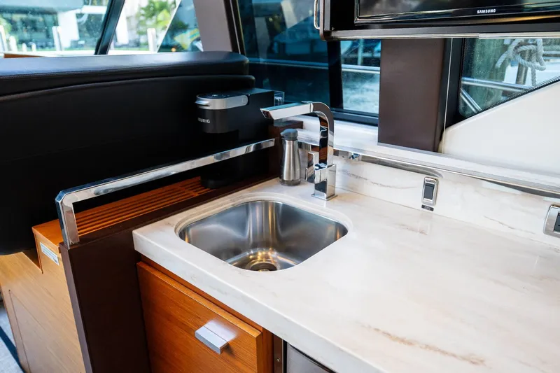 Down Time Yacht Photos Pics Modern kitchen area in 2015 Tiara Yachts C44 Coupe with sleek sink and countertop.