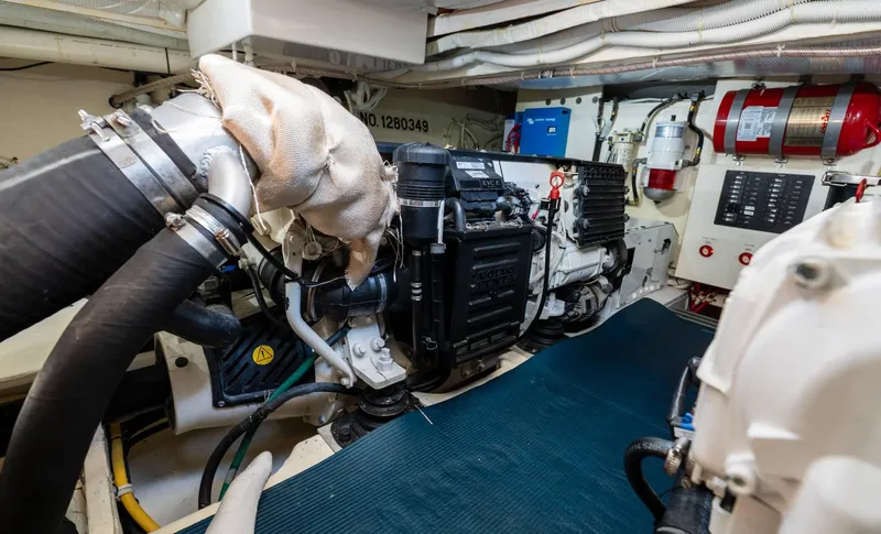 Down Time Yacht Photos Pics Engine room of 2015 Tiara Yachts C44 Coupe, showcasing mechanical components and systems.