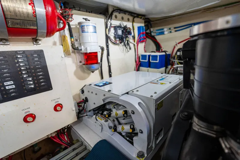 Down Time Yacht Photos Pics Engine room of 2015 Tiara Yachts C44 Coupe with electrical panels and safety equipment.