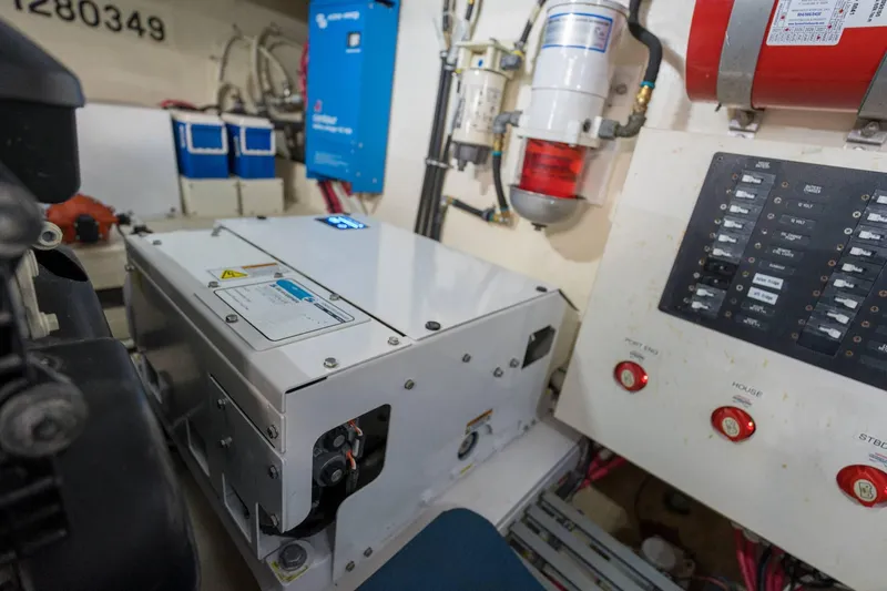 Down Time Yacht Photos Pics Engine room of 2015 Tiara Yachts C44 Coupe with control panels and equipment.